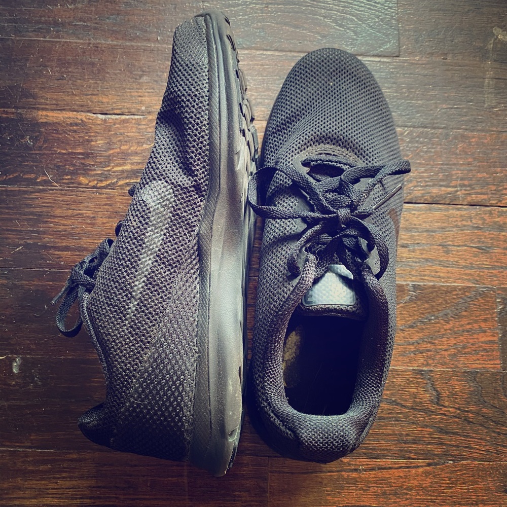 Black on black mesh Nike trainers
